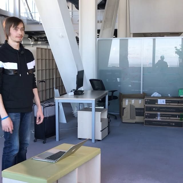 The first real office, unpacking machines. Everything before this ran out of a flat and a Skype window.